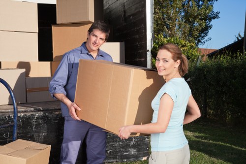 Professional movers organizing commercial furniture for office removals